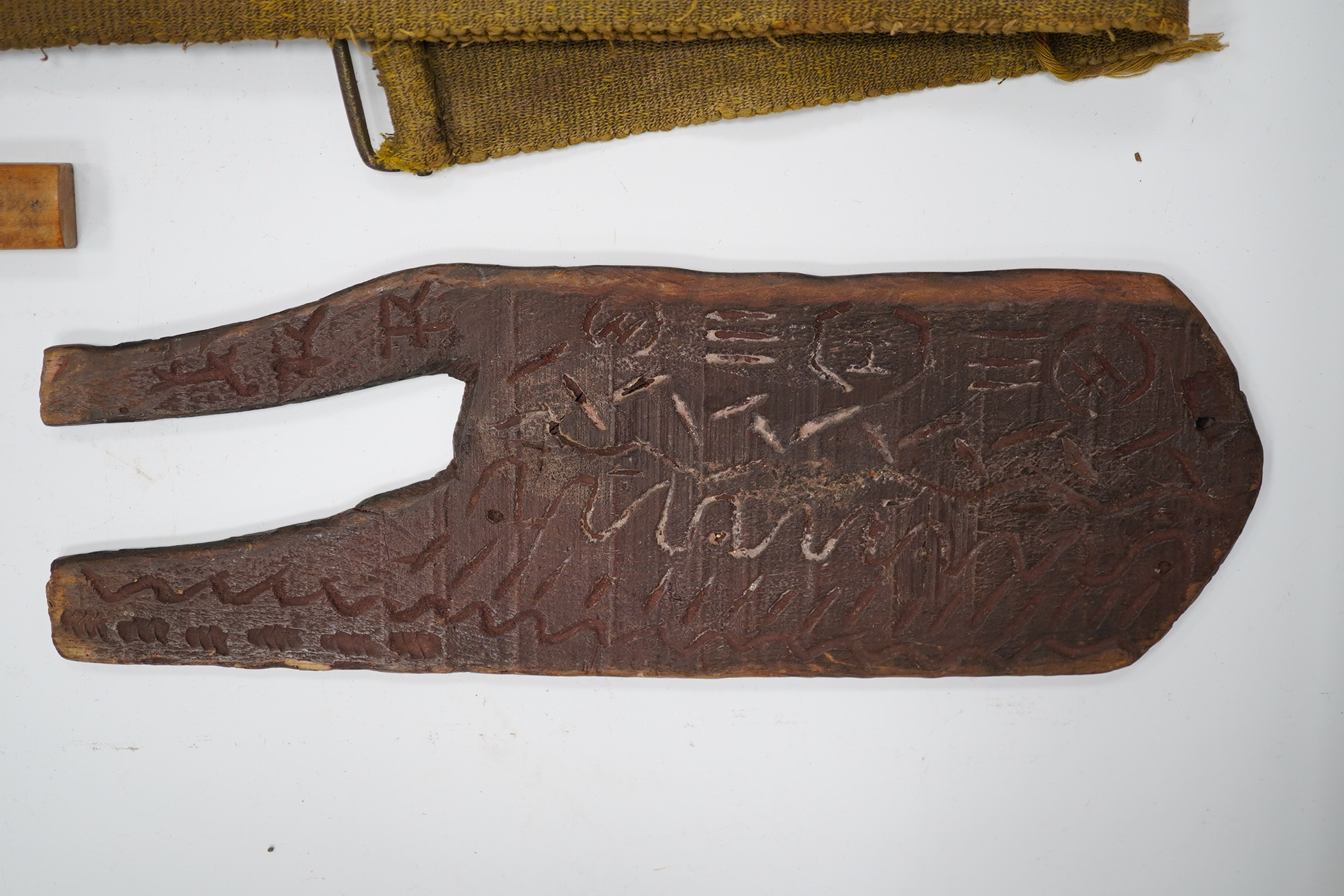 A section of a vellum family tree, converted into a bag, Together with an oak tripod, two whips, a Balanese Kris with lion man grip, a hunting dagger with horn grips, a small knife, etc. Condition - poor to fair